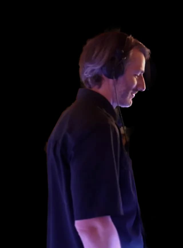 Patrick DJing at a wedding, seen from the side