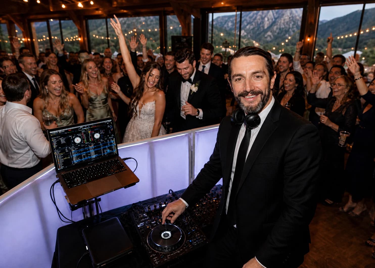 Editorial wedding dance floor moment with guests gathered around the couple in a celebration scene