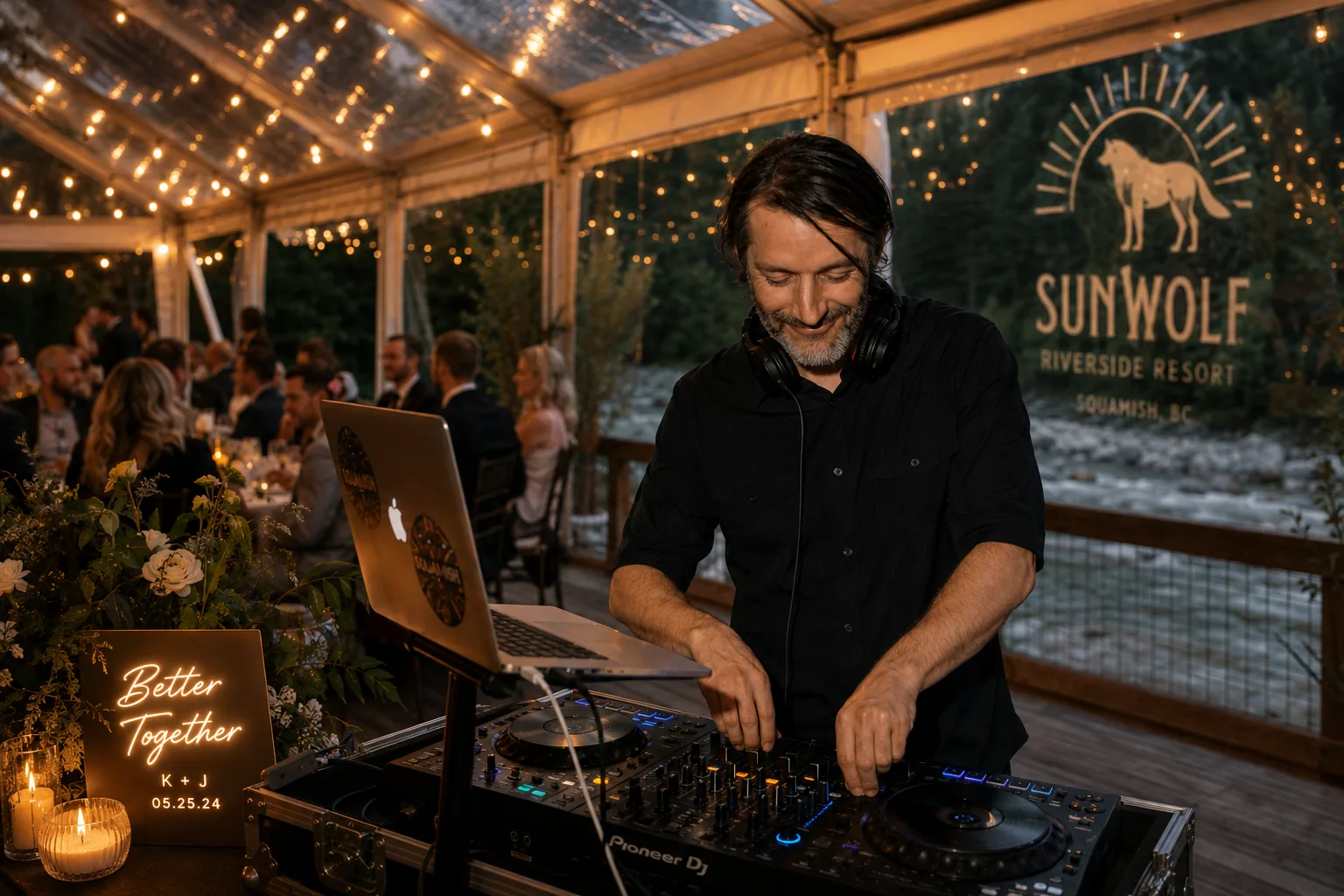 DJ Patrick from Howe Sound DJ performing at a wedding reception inside the riverside tent at Sunwolf Riverside Resort in Squamish, BC.
